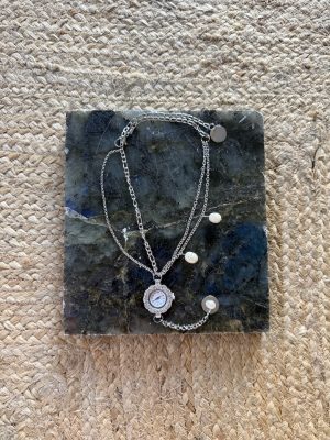 Silver Clock and Pearl Necklace