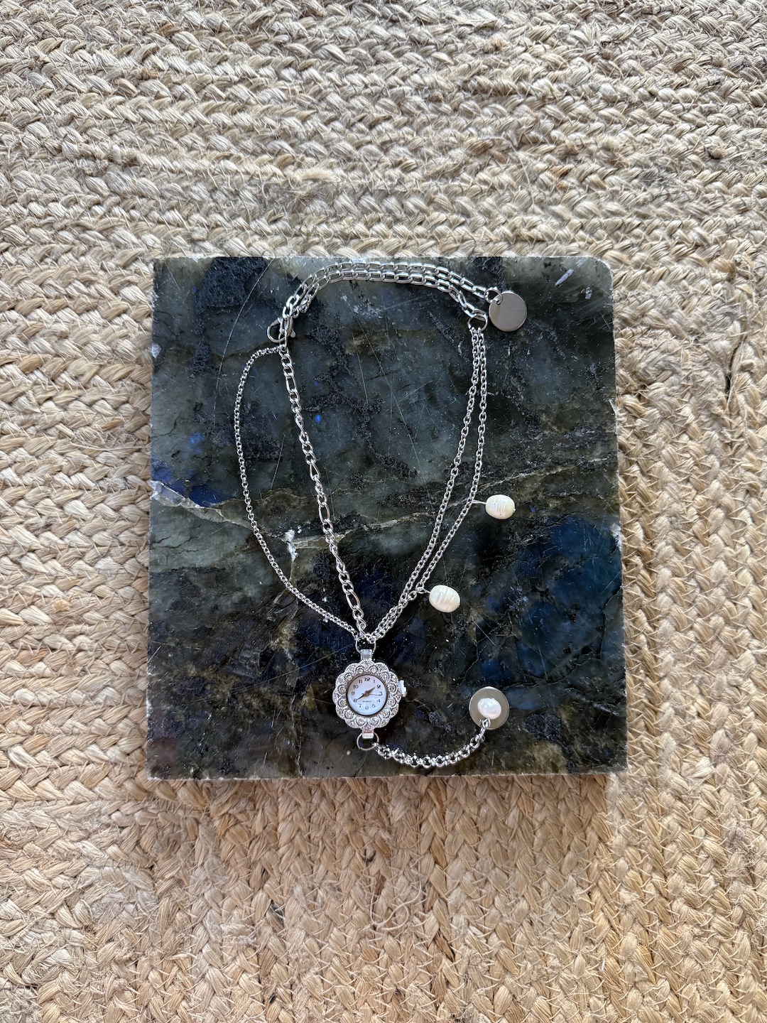 Silver Clock and Pearl Necklace